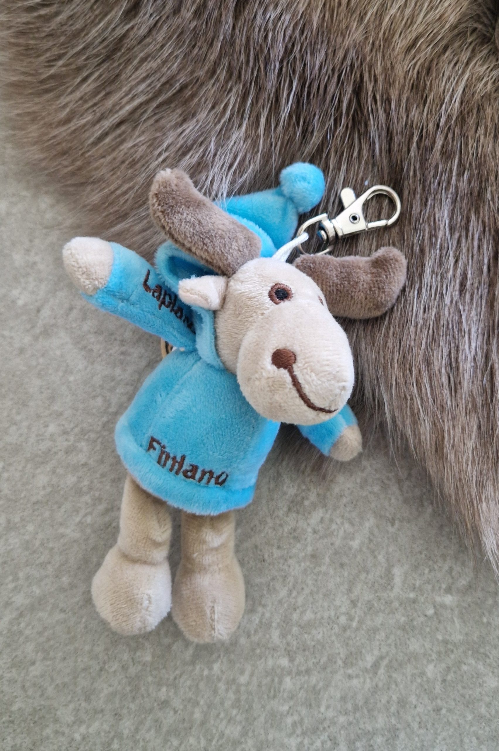 Sleeping deer backpack decoration, light blue